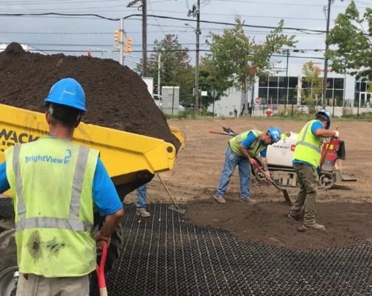 Backfilling EZ Roll Grass Paver cells with sandy loam prior to seeding