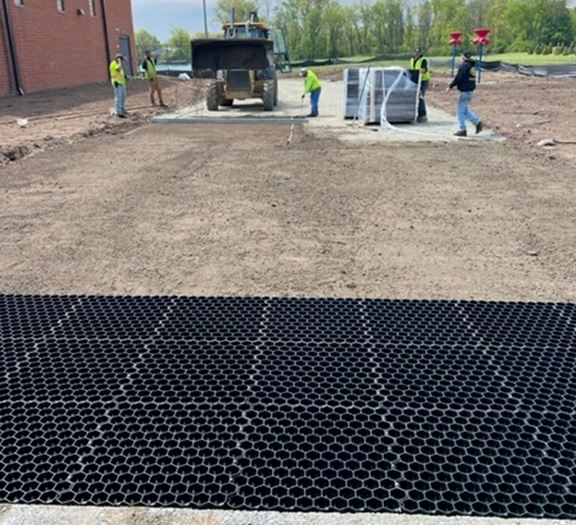 Field installation of NDS EZ Roll Grass Pavers being connected