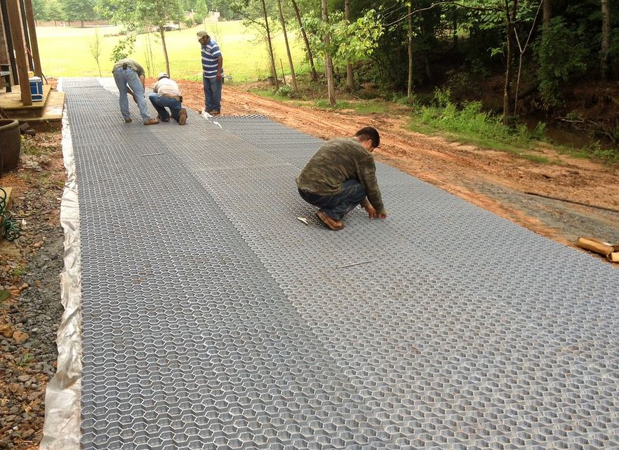 Backfilling the EZ Roll Gravel Paver cells with clean angular stone