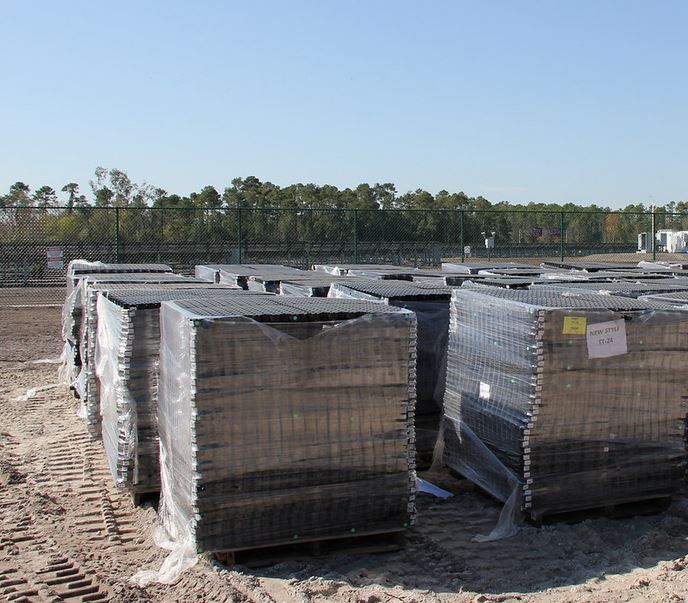 Pallets of NDS Tufftrack grass pavers ready for shipping
