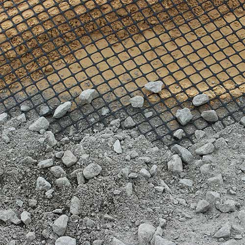 biaxial geogrid installed under a layer of gravel